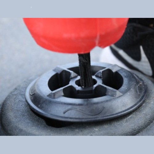 Flexible bollard bolted down to concrete road surface