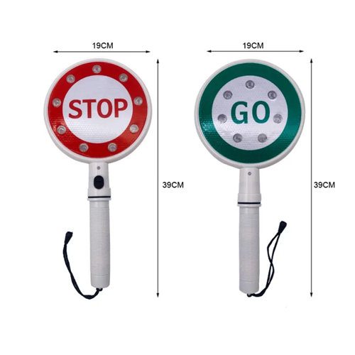 Traffic marshal using handheld stop go light at road works